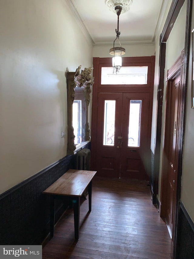 entryway with french doors, dark hardwood / wood-style flooring, and ornamental molding