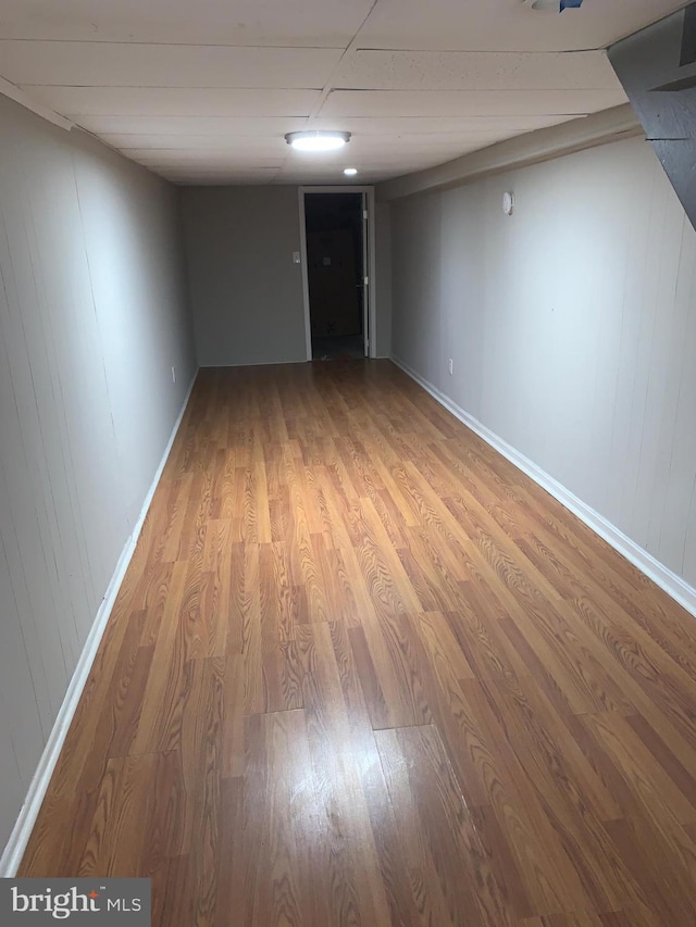 basement featuring hardwood / wood-style flooring