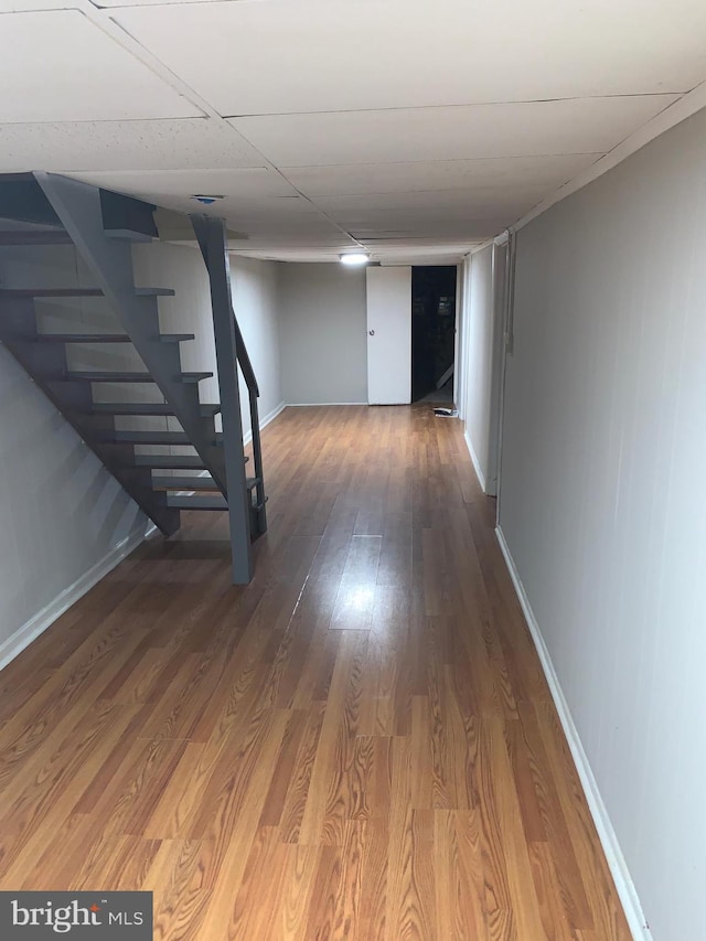 basement with hardwood / wood-style flooring