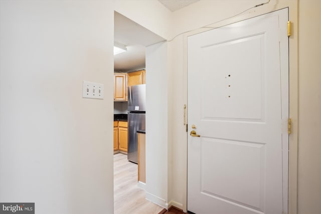 hallway featuring light wood-type flooring