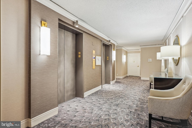 corridor with carpet flooring, elevator, crown molding, and a textured ceiling