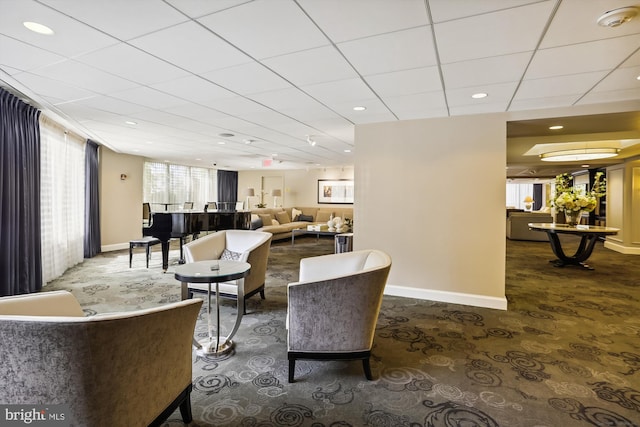 interior space featuring a drop ceiling