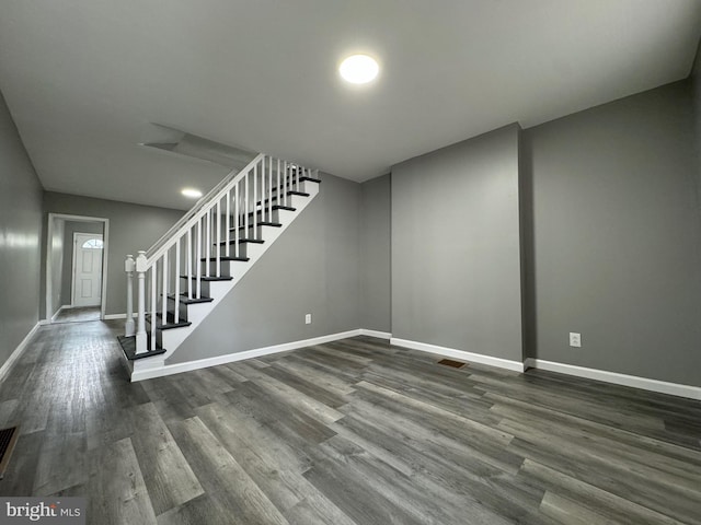 basement featuring dark hardwood / wood-style floors