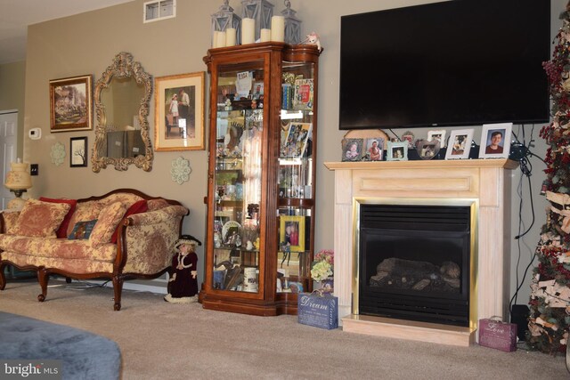 63 Lookout Dr, Manahawkin, NJ 08050 - living area featuring carpet and a fireplace with raised hearth