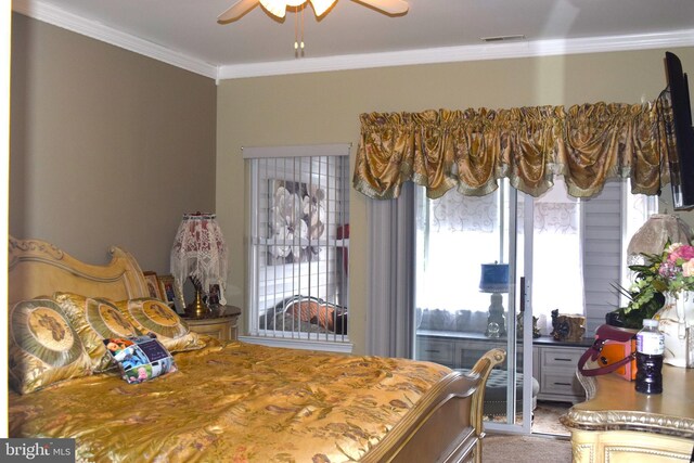 bedroom featuring ornamental molding and carpet floors