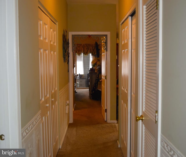 hall with carpet floors