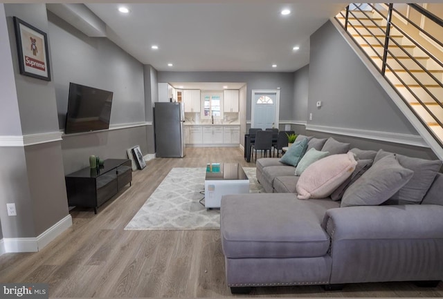 living room with light hardwood / wood-style floors