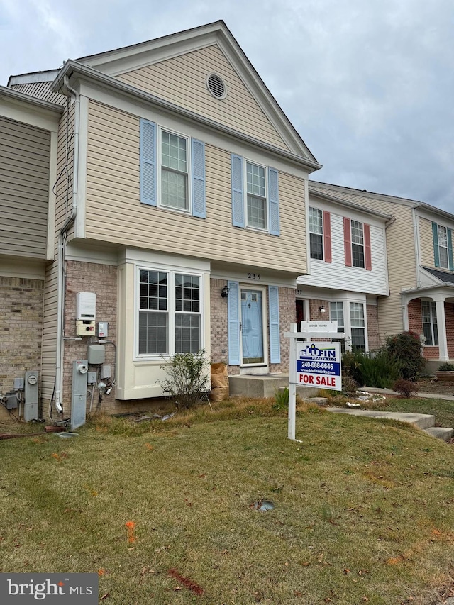 view of property featuring a front yard