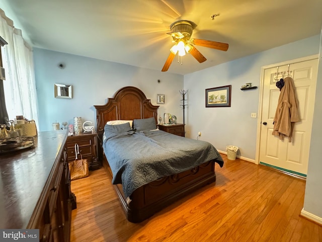 bedroom featuring a closet, ceiling fan, and light hardwood / wood-style flooring