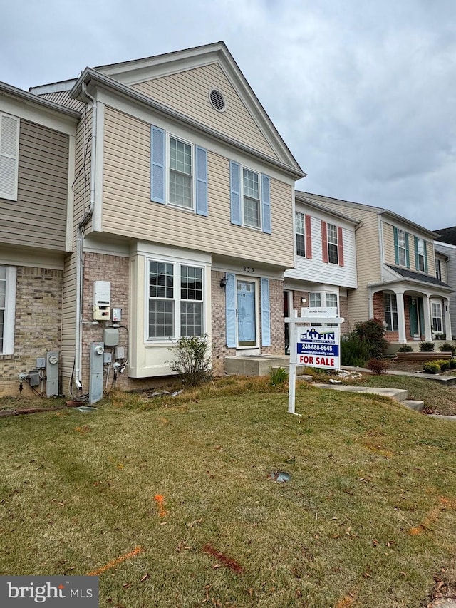 view of property with a front lawn