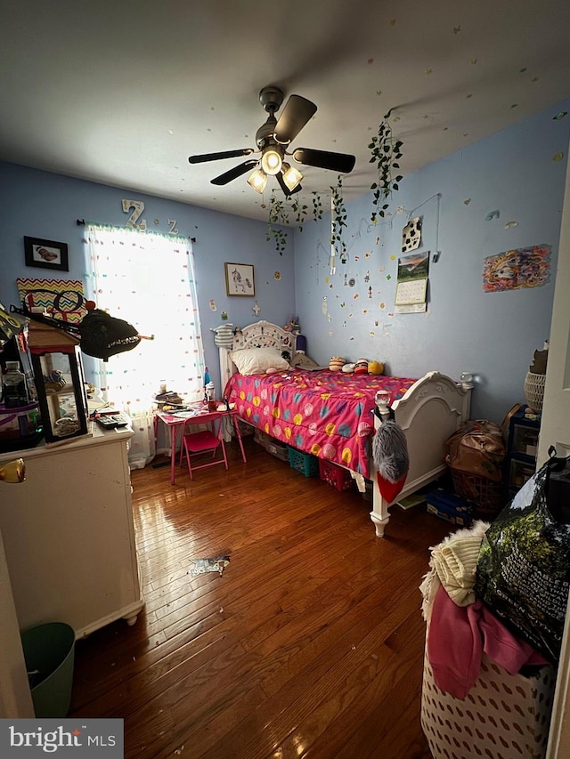 bedroom featuring hardwood / wood-style floors and ceiling fan