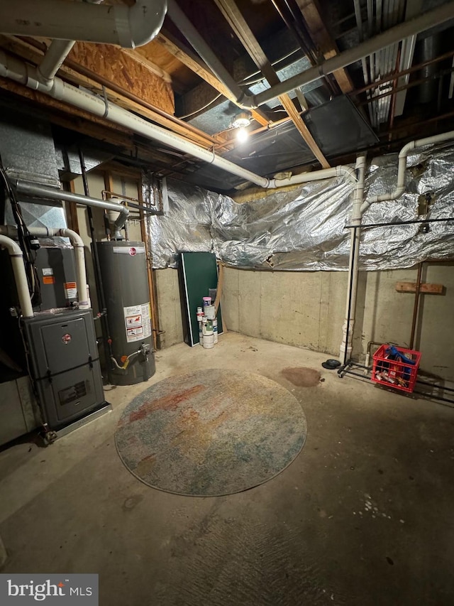 basement featuring heating unit and water heater