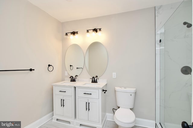 bathroom featuring vanity, toilet, and an enclosed shower