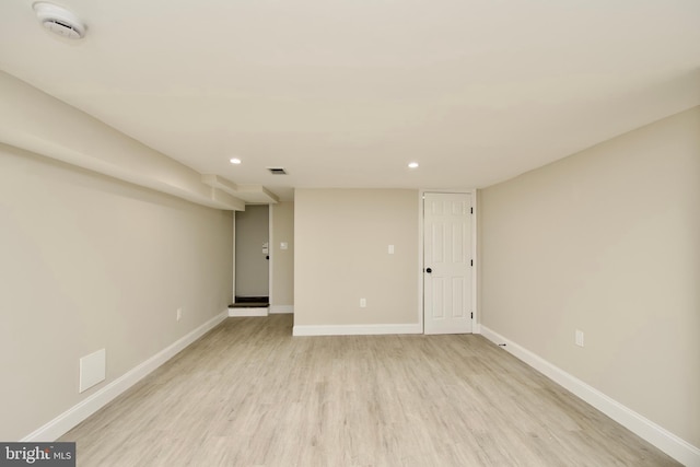 unfurnished room with light hardwood / wood-style flooring