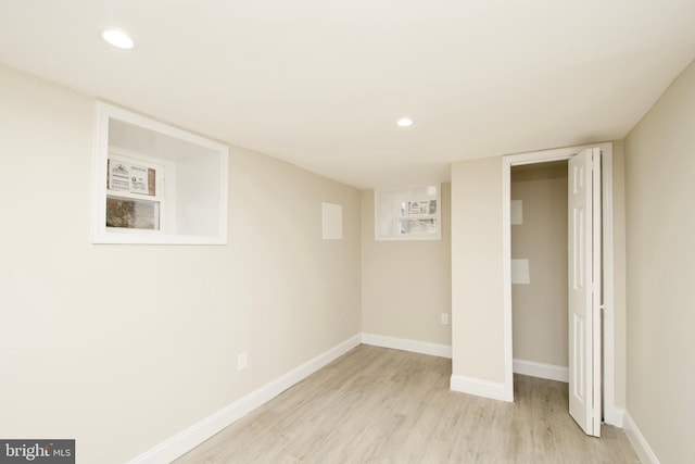 basement featuring light hardwood / wood-style flooring