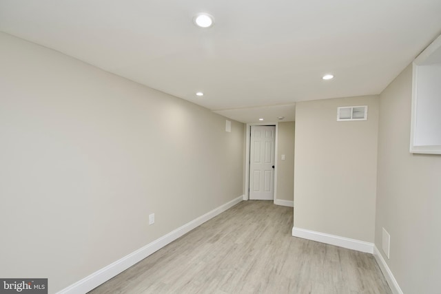 unfurnished room with light hardwood / wood-style flooring