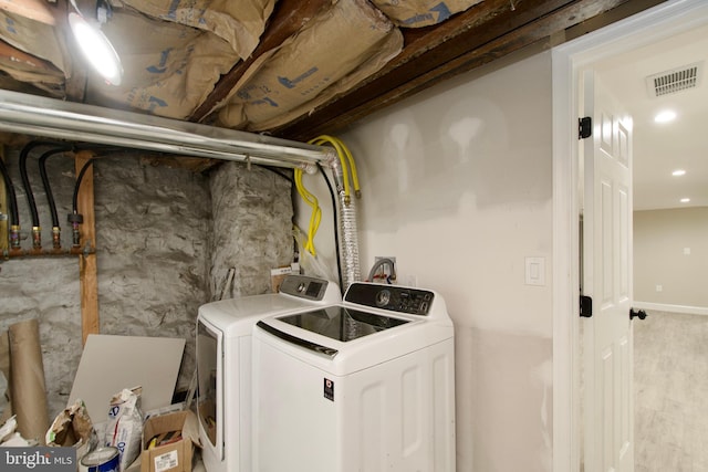 washroom featuring independent washer and dryer