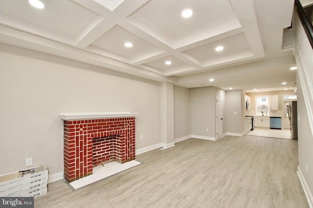 unfurnished living room with beam ceiling, light wood-type flooring, and coffered ceiling