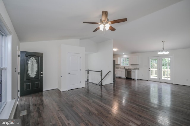 foyer entrance with dark hardwood / wood-style flooring, ceiling fan with notable chandelier, vaulted ceiling, and sink