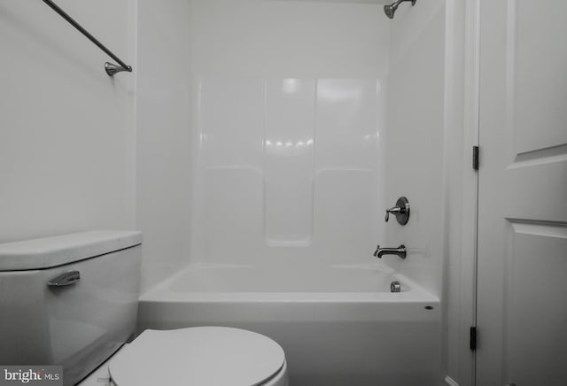 bathroom with shower / bath combination and toilet