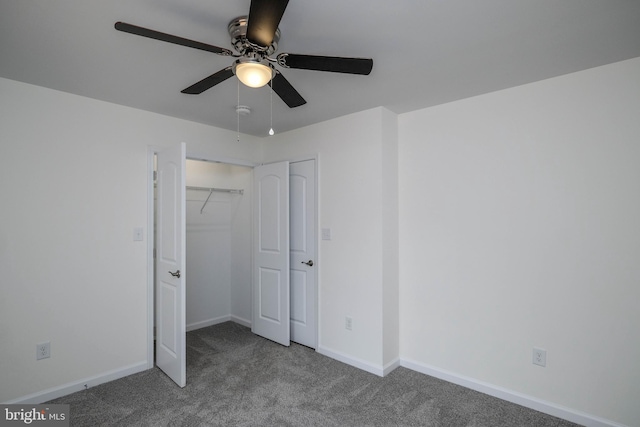 unfurnished bedroom with ceiling fan, a closet, and carpet