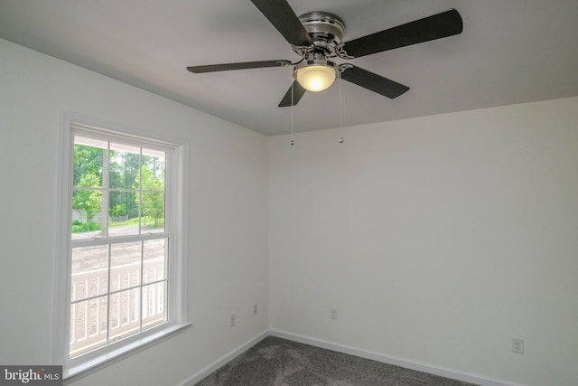 carpeted empty room with ceiling fan