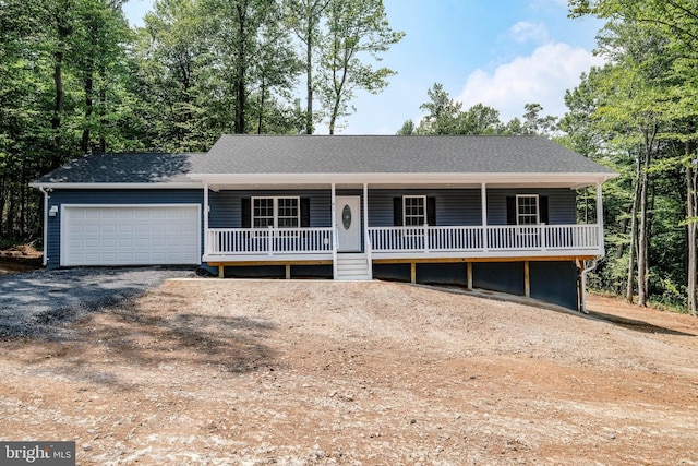 view of front of house featuring covered porch and a garage