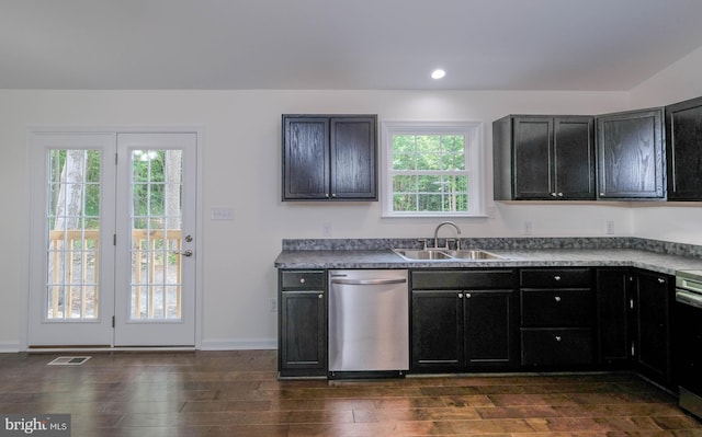 kitchen with dark wood-type flooring, sink, a healthy amount of sunlight, and appliances with stainless steel finishes