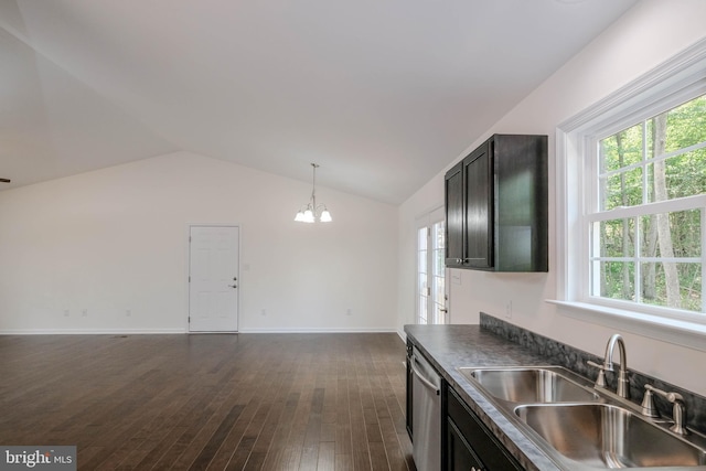 kitchen with dishwasher, lofted ceiling, sink, dark hardwood / wood-style floors, and decorative light fixtures