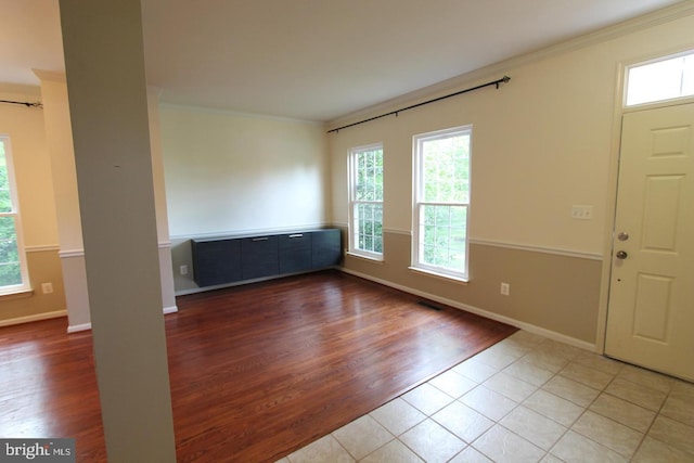 12360 Corncrib Ct, Bristow, VA 20136 - entryway with plenty of natural light, crown molding, baseboards, and tile patterned flooring