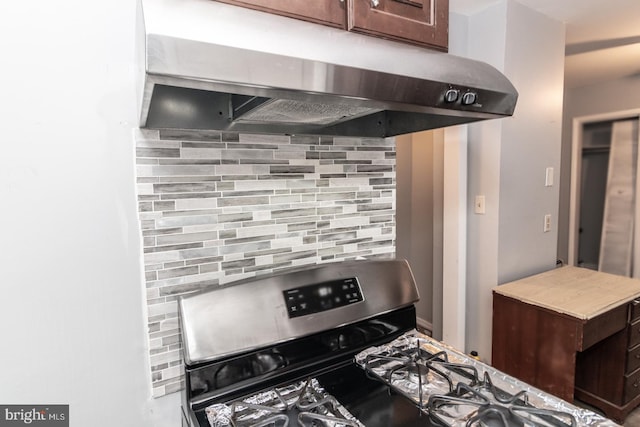 kitchen featuring decorative backsplash, dark brown cabinets, and stainless steel range with gas stovetop