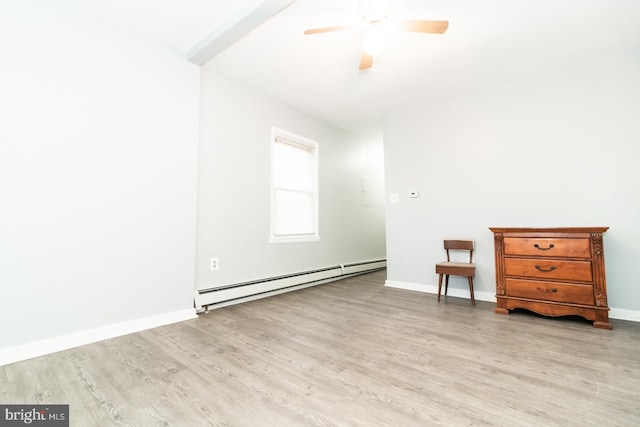 empty room featuring a baseboard radiator, light hardwood / wood-style flooring, and ceiling fan