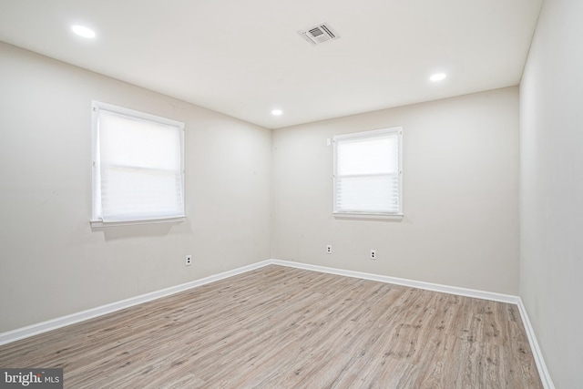 empty room with light wood-type flooring