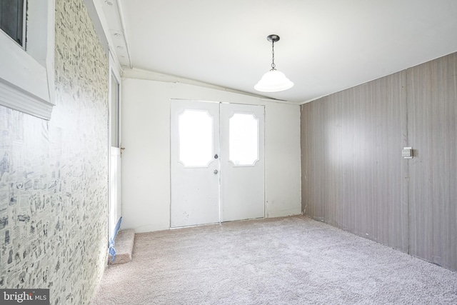 foyer entrance with carpet