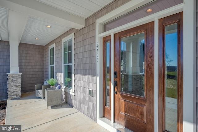 entrance to property featuring a porch