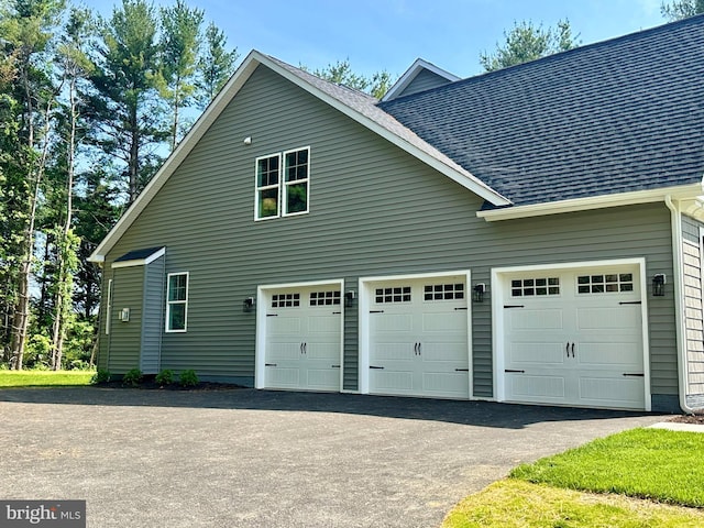 3104 Paper Mill Rd, Phoenix, MD 21131 - view of home's exterior with driveway, roof with shingles, and a garage