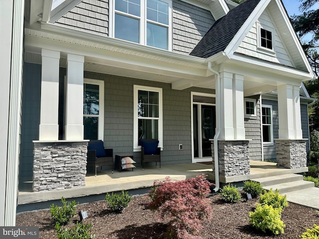 3104 Paper Mill Rd, Phoenix, MD 21131 - view of exterior entry featuring a porch, stone siding, and a shingled roof