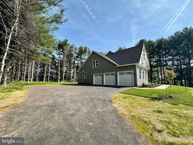 3104 Paper Mill Rd, Phoenix, MD 21131 - view of home's exterior with asphalt driveway, a shingled roof, and a yard