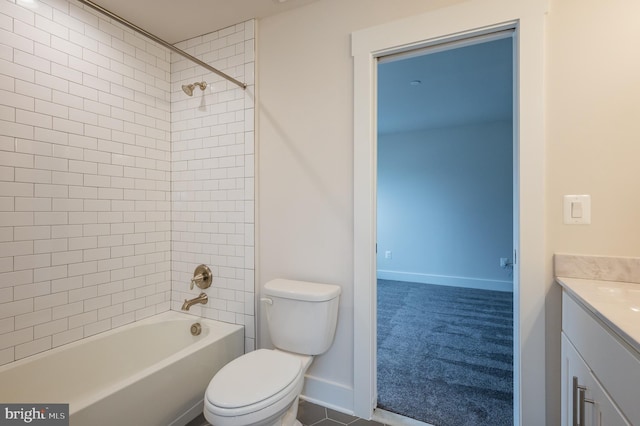 full bathroom featuring vanity, toilet, and tiled shower / bath