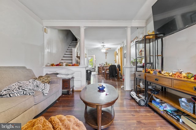 living room with dark hardwood / wood-style floors, ceiling fan, ornamental molding, and decorative columns