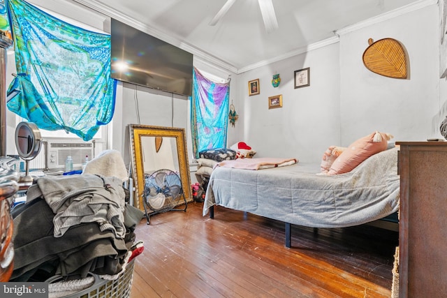 bedroom featuring hardwood / wood-style flooring, ceiling fan, and ornamental molding