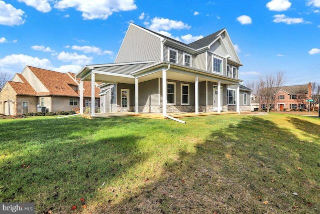 view of front of home featuring covered porch and a front yard