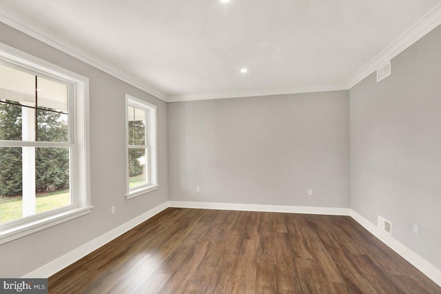 unfurnished room featuring dark hardwood / wood-style floors and ornamental molding