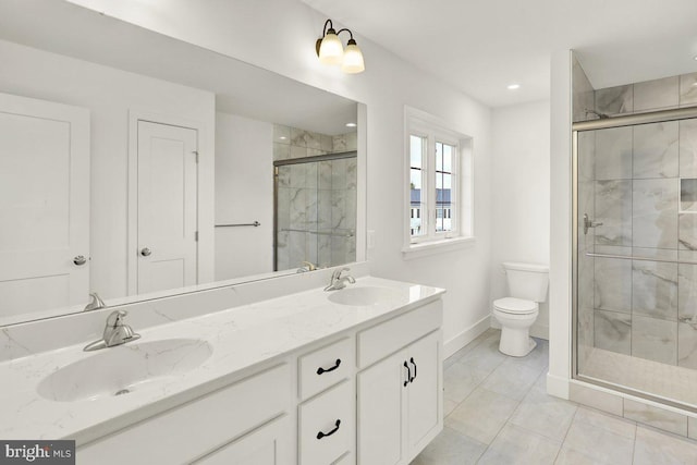 bathroom with tile patterned floors, vanity, toilet, and an enclosed shower