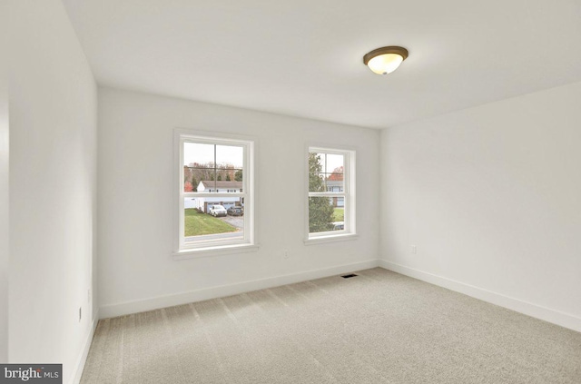 empty room featuring carpet floors