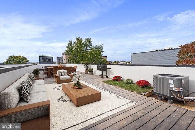 deck featuring central AC and an outdoor hangout area