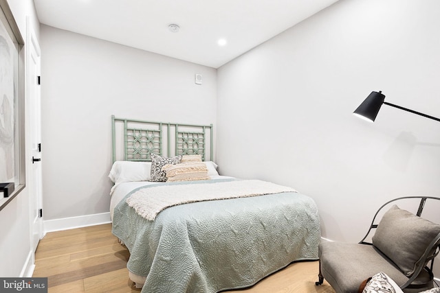 bedroom with wood-type flooring