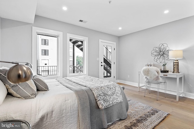 bedroom with light hardwood / wood-style floors