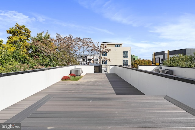 wooden terrace featuring central air condition unit