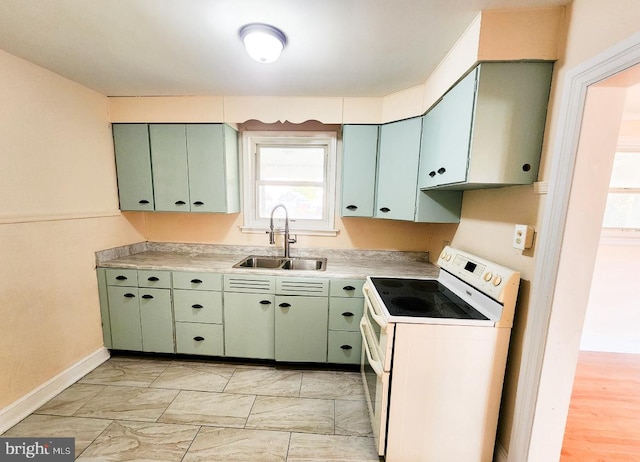 kitchen with green cabinets, sink, light hardwood / wood-style floors, and white electric range